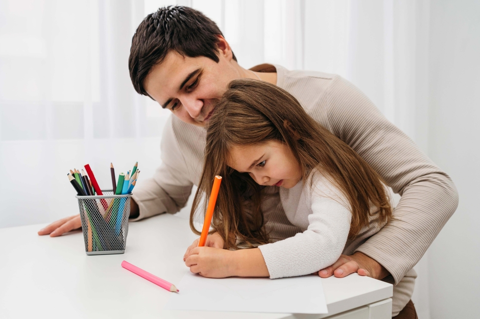 A father playing with his daughter