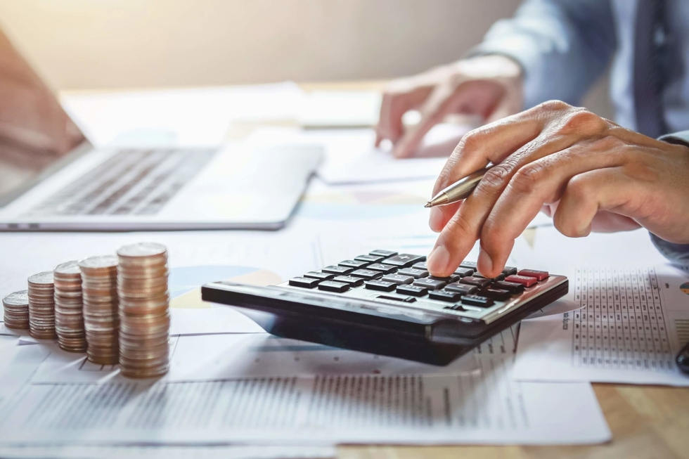 Person make calculations while counting money